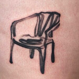 Figurative chair, tattoo in black work style, by tattooer Cee Burgundy.