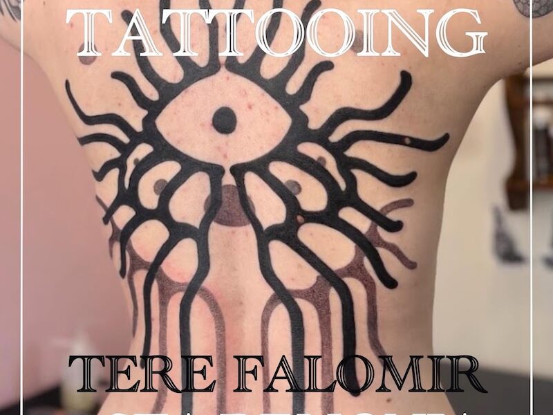 Tattoo of eye transforming to organic ornamental in blackwork style, by tattooer Tere Falomir.